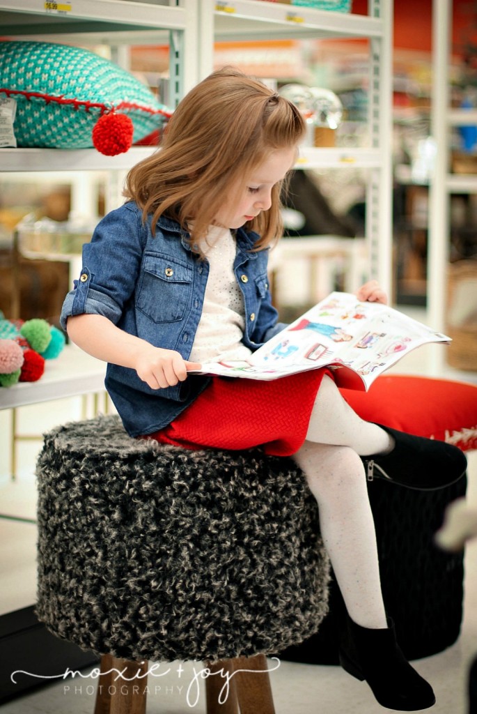 girl reading Target flyer
